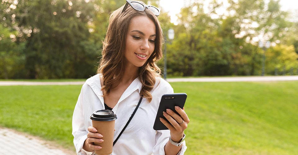 Pretty young woman spending time at the park