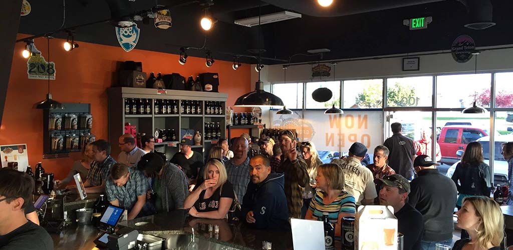 Singles drinking beer and hooking up during the day at The Growler Guys bar in Reno