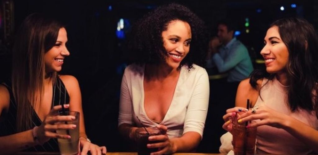 3 girls drinking during power hour at The tobacco club in Richmond