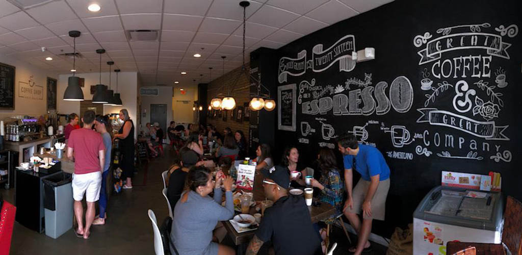 A busy day at Holy Grain Coffee Shop, filled with people mingling