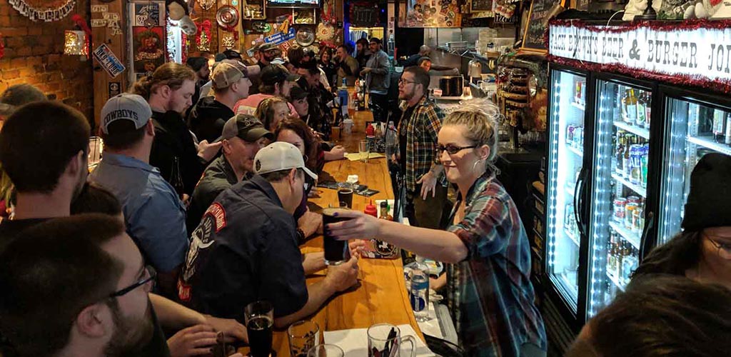 Crowd being served beer and burger at Jack Brown’s in Richmond