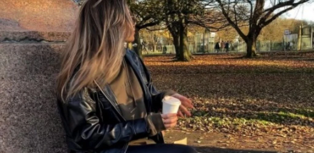 A cute Leeds single drinking coffee outside Coffee on the Crescent