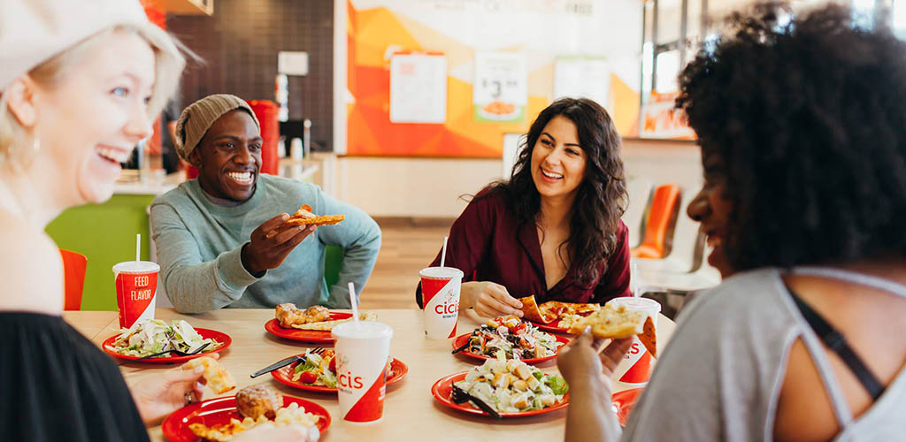 Friends enjoying the pizza at Cici's