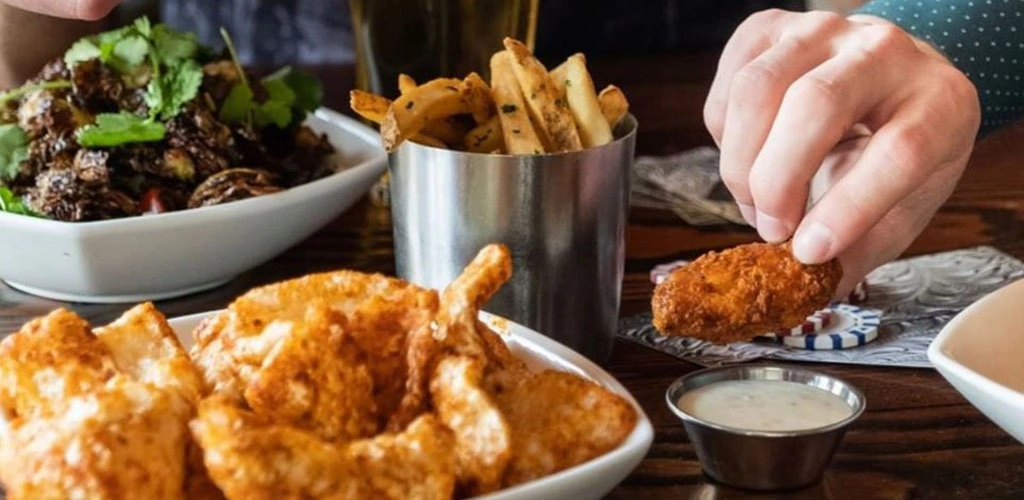 Chicken wings, fries and a salad from Prospect at The Padre Hotel