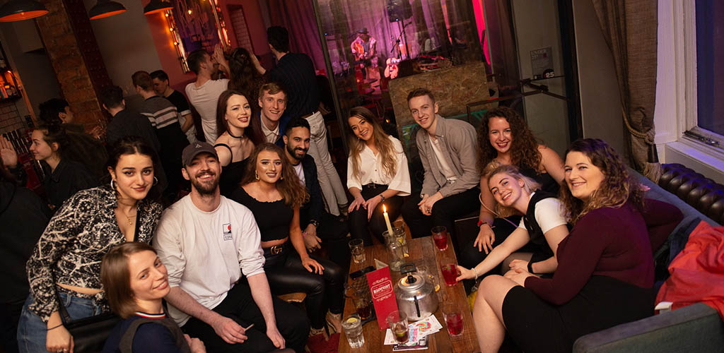 Young folks having drinks at The Riding Room