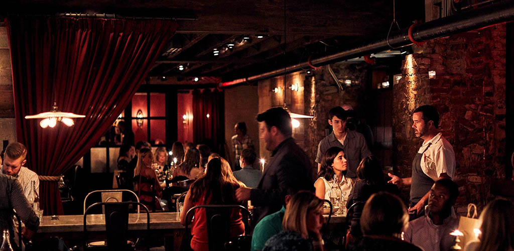 The dimly lit and romantic dining area of Sotto