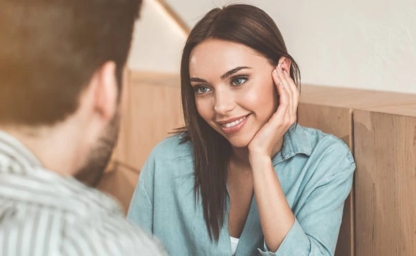 Woman with a man who knows how to build sexual tension even if they've just met