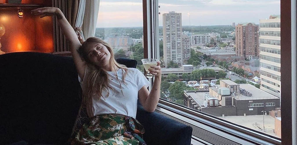 A woman enjoying a drink and the view from Blu Bar and Lounge