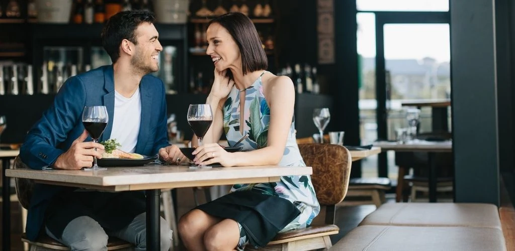 A couple flirting and drinking on a date at Social House Gold Coast