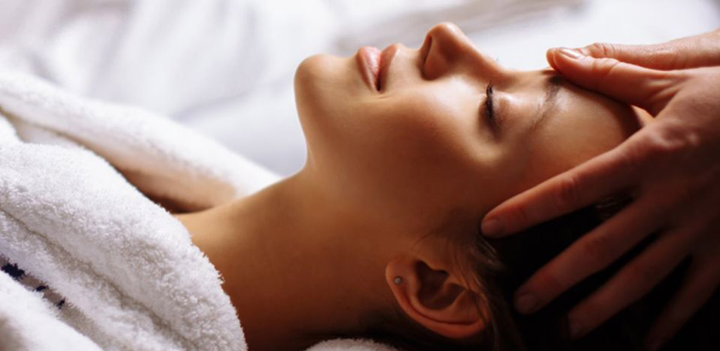 A woman getting a massage at Woodhouse Day Spa