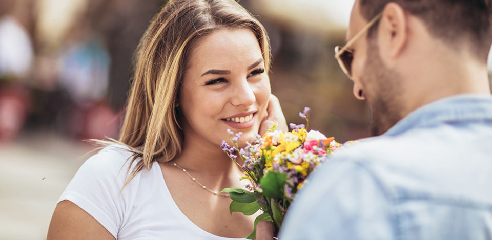 man flirting after learning how to pursue a woman