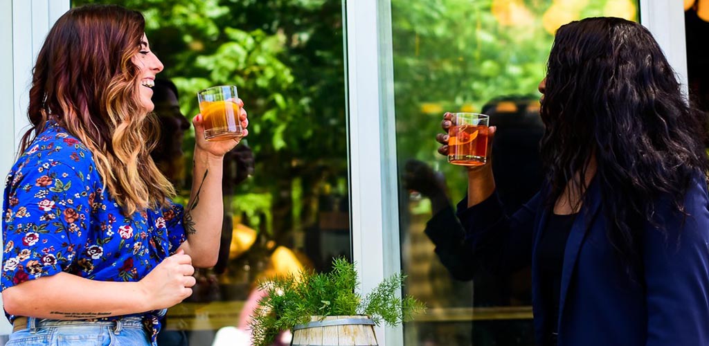 Ladies enjoying drinks at Oak and Ivy