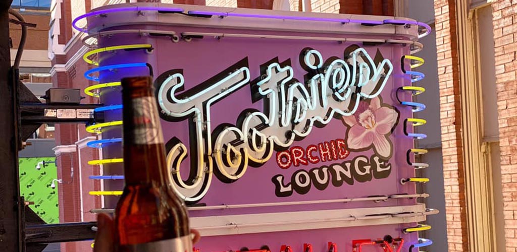 The pink sign of Tootsie's Orchid Lounge