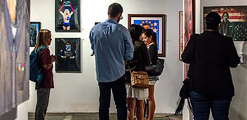 People viewing the paintings at The Museum of Contemporary Art