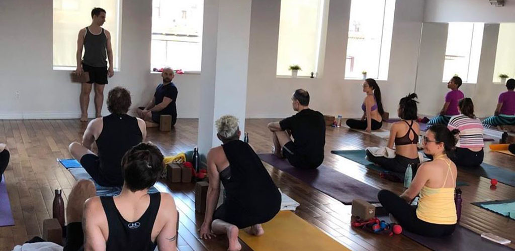 Get out of your comfort zone to meet single women in Toronto at Union Yoga and Wellness