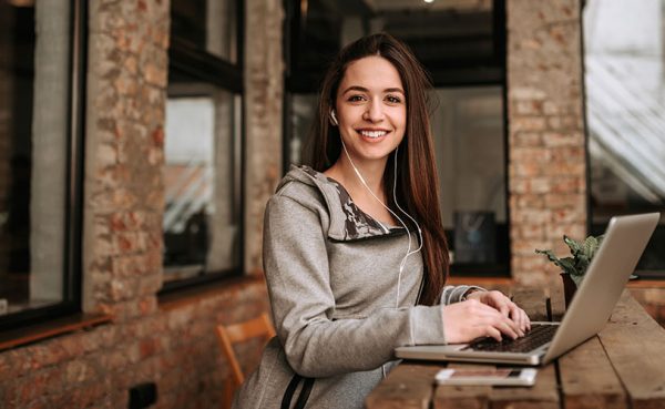 Single woman seeking men in Stoke-on-Trent working on her laptop at a cafe