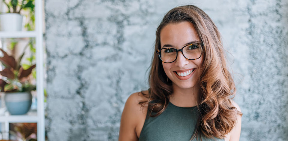 New York girl in glasses smiling