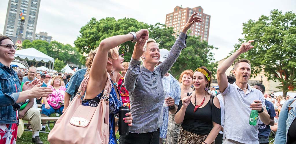 People dancing in the park at Bastille Days Festival