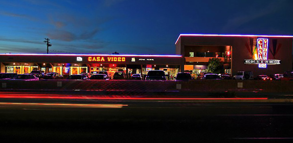 Exterior of Casa Video and Casa Film Bar at night