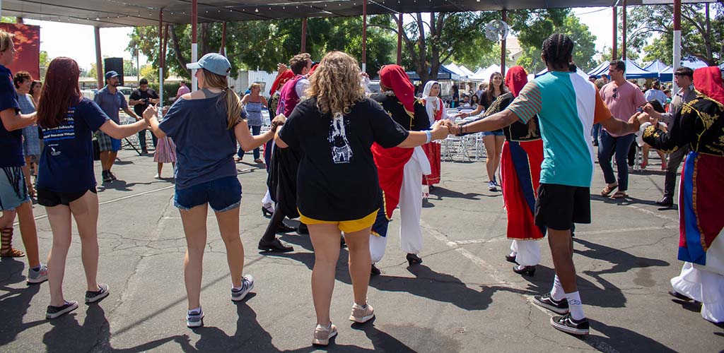 Lots of people dancing at the Fresno Greek Fest