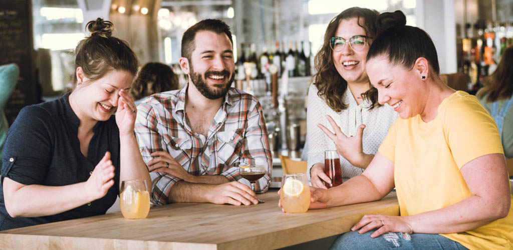 A group of friends drinking cocktails at Boomtown Coffee