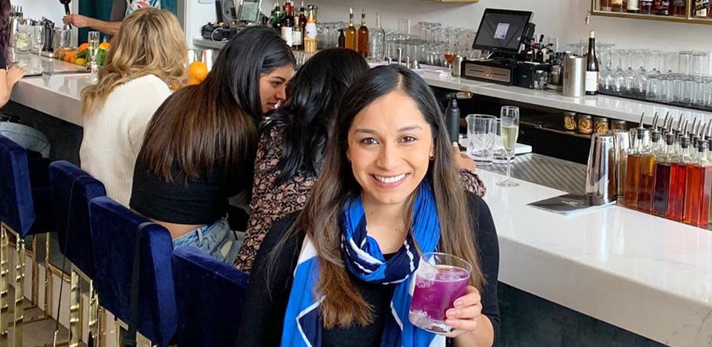 A girl at Modernist holding a cool cocktail