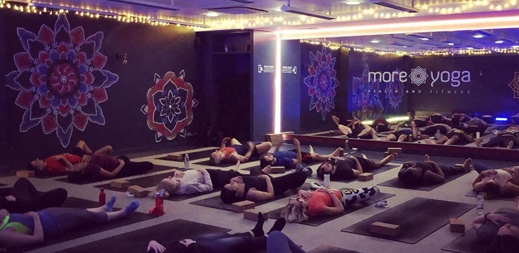 A MoreYoga class with ambient lighting