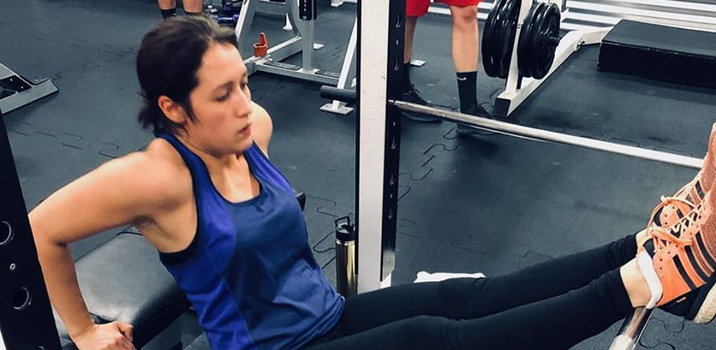 A girl working out at Lloyd Athletic Club