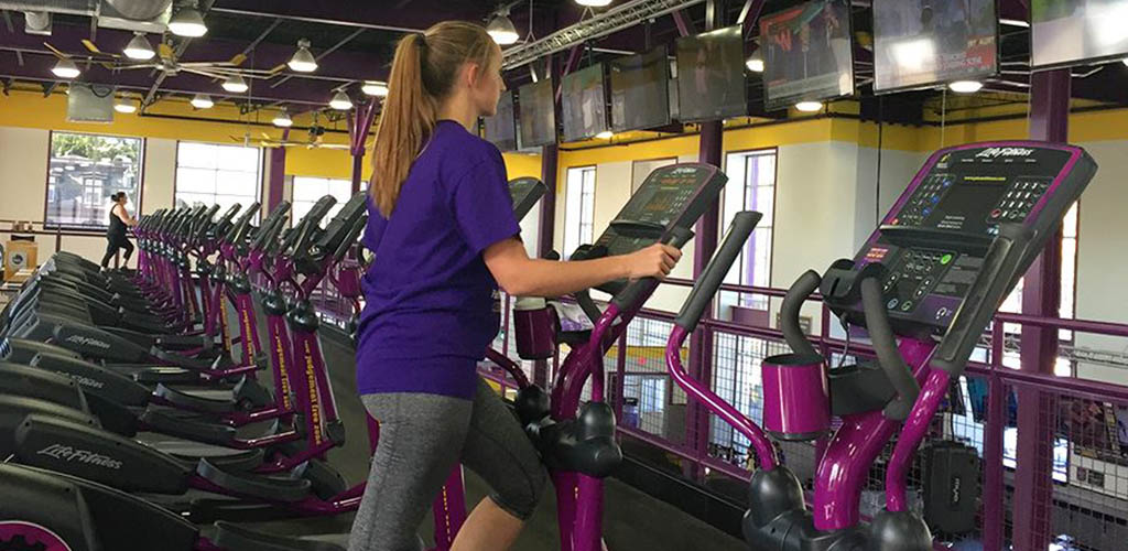 Wokring out on the elliptical machine at Planet Fitness