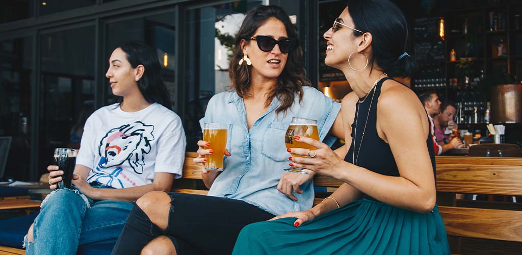 Three girls at a bar