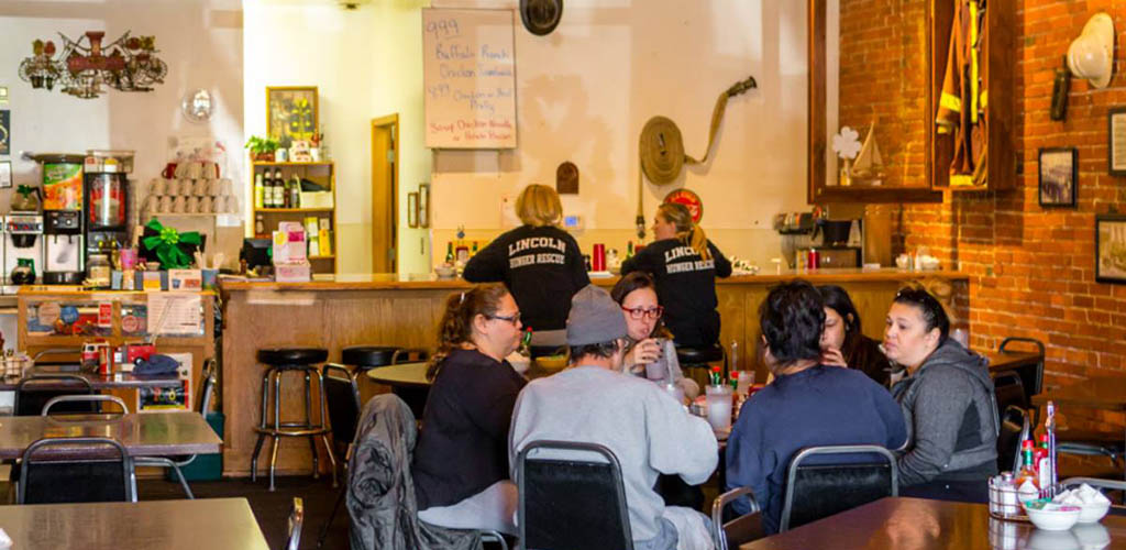 Friends enjoying coffee at Engine House Cafe