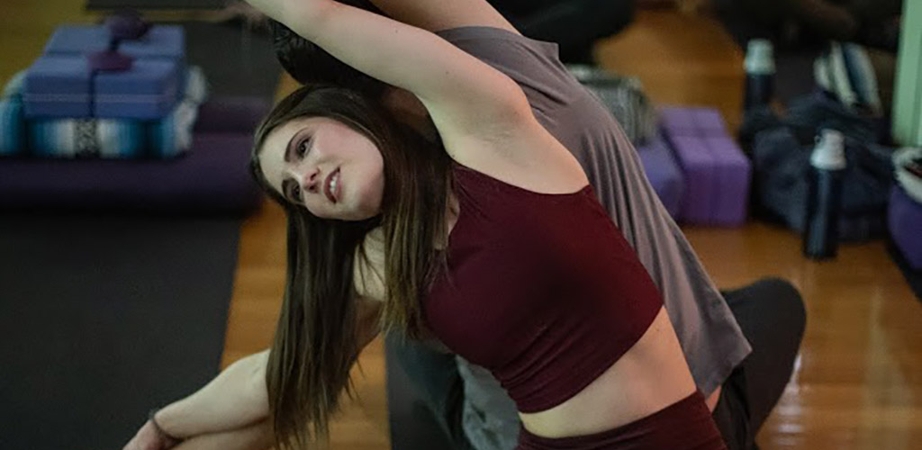 Partners at a yoga class in Sky Fitness and Wellbeing