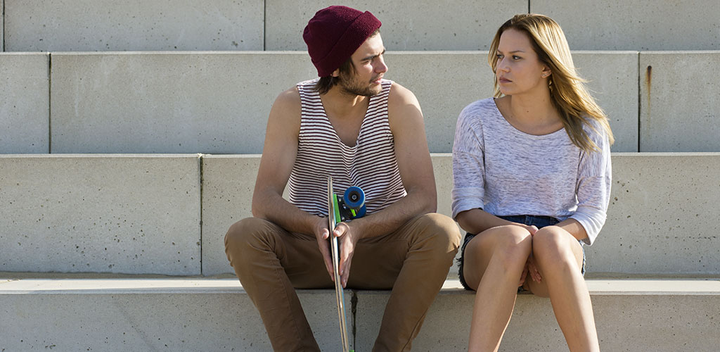 A young man and woman in a deep conversation