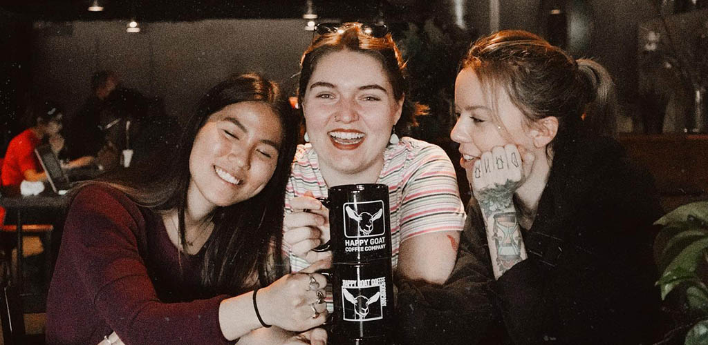 Girls having coffee at Happy Goat Coffee Co.