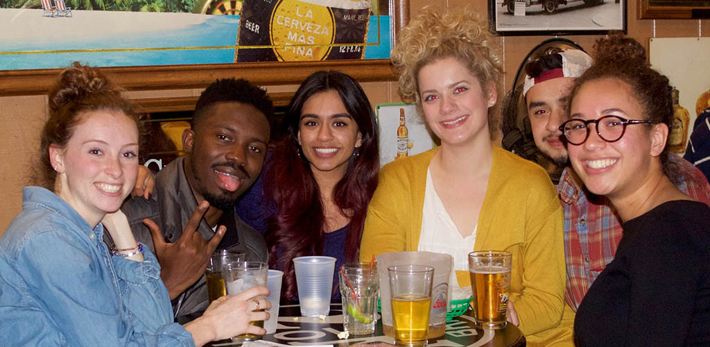 A group of friends hanging out in Murphy’s Pub having drinks