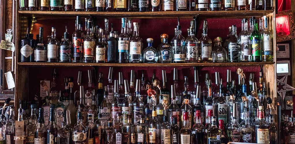 The liquor shelf at Poison Girl Cocktail Lounge