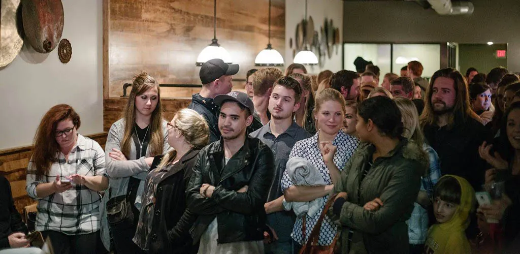 The audience during a live performance at Quixotic Coffee