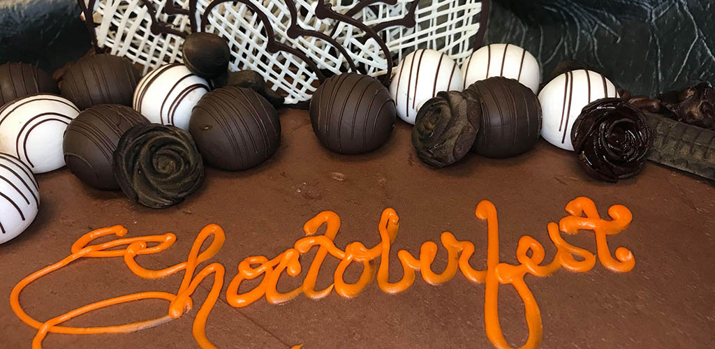 The Choctoberfest sign on a chocolate cake