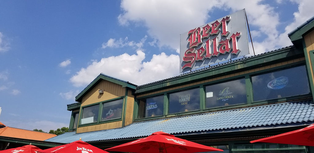 Exterior of chalet-style pub the Beer Sellar with green roof