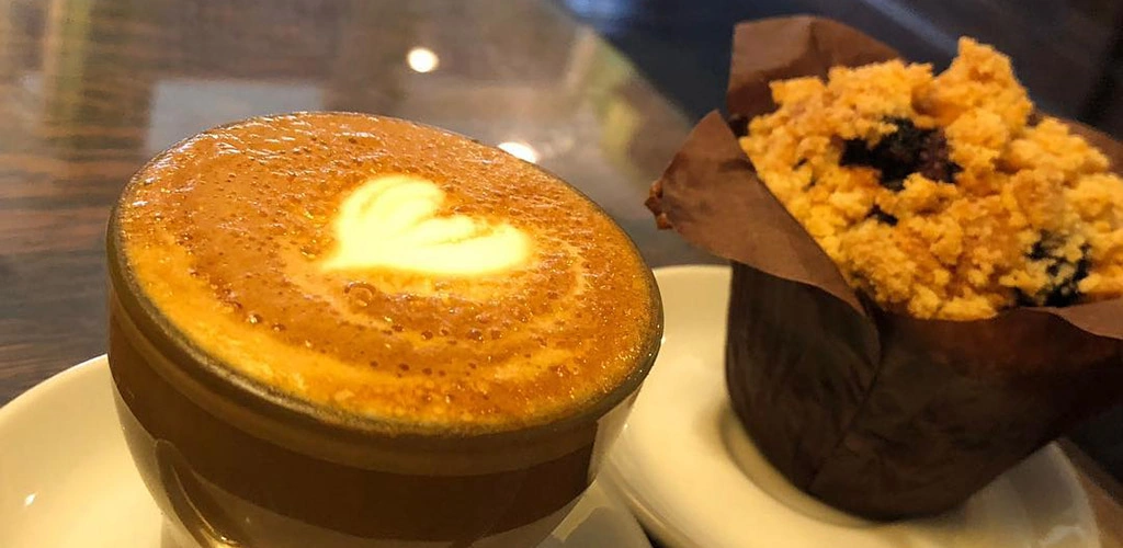 A latte and muffin from Big Dog Coffee Shop