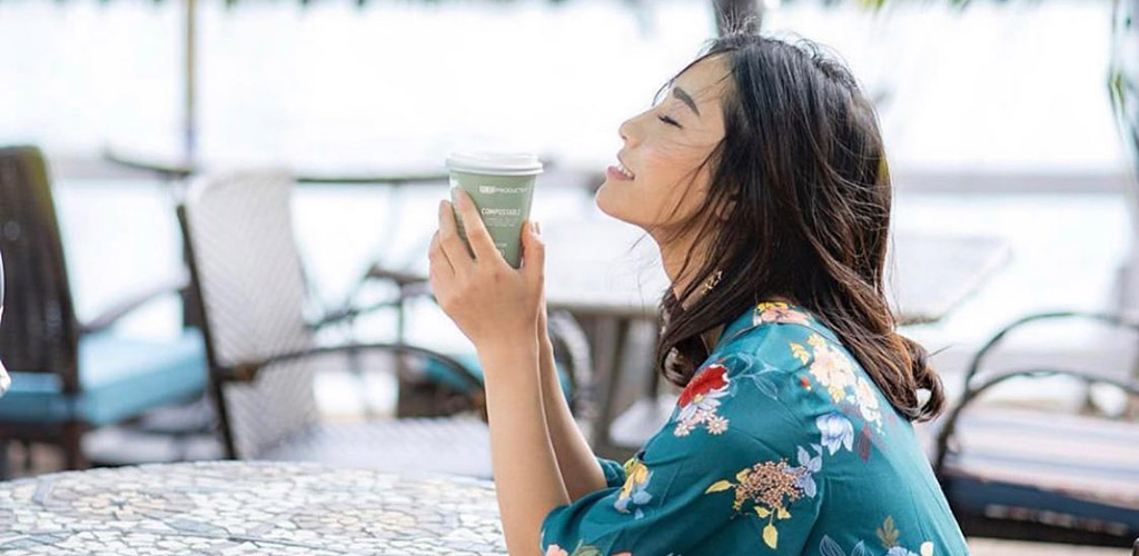 Enjoying her coffee at the patio of Island Brew Coffeehouse