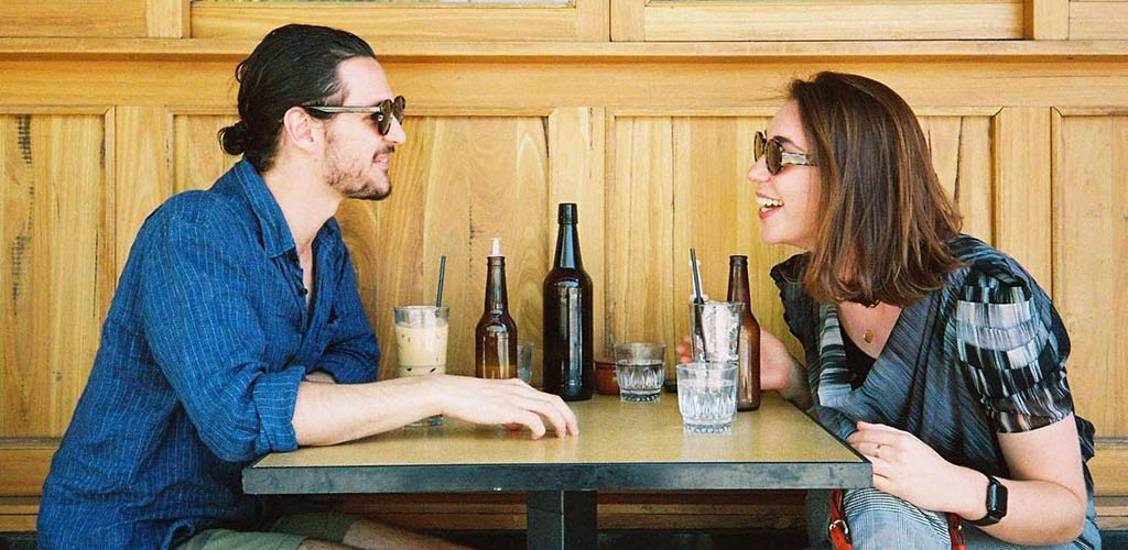 A Canberra couple drinking coffee on a date at The Cupping Room