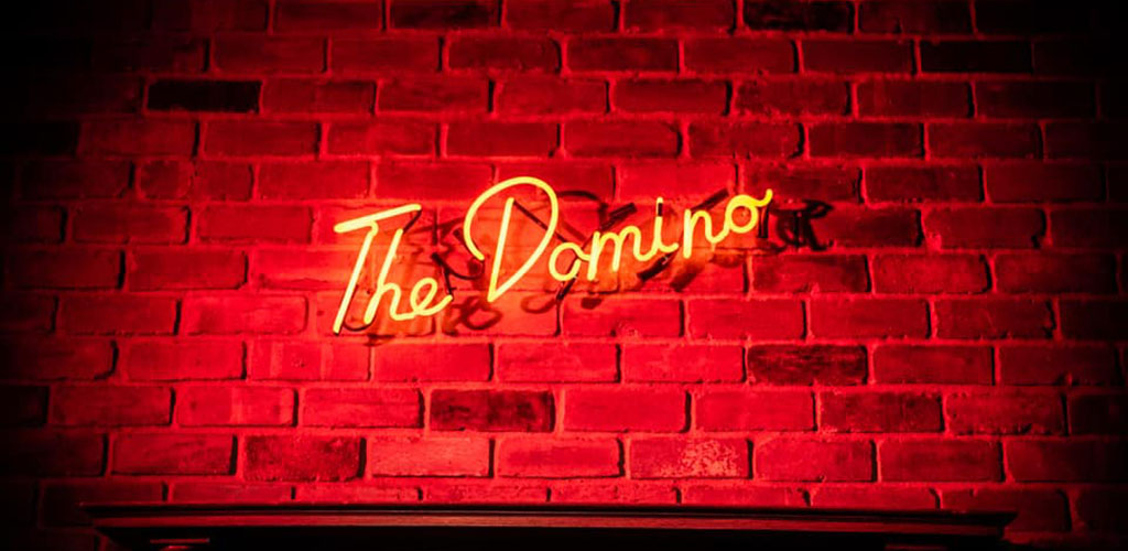 The elegant neon sign of The Domino