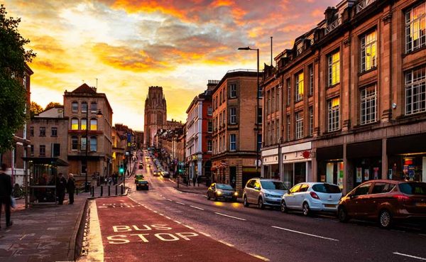 Famous street in the center of Bristol, UK in the evening during the colorful sunset