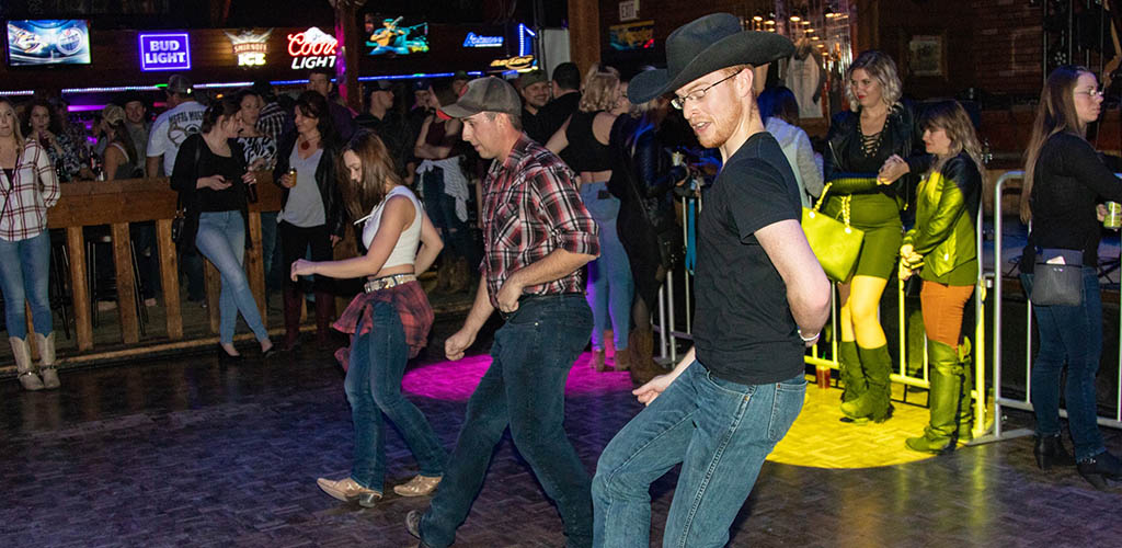 Line dancing at Cook County Saloon