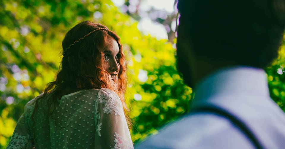 Happy couple walking in the forest