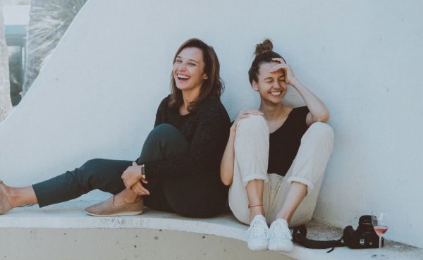 Two women being told a good story