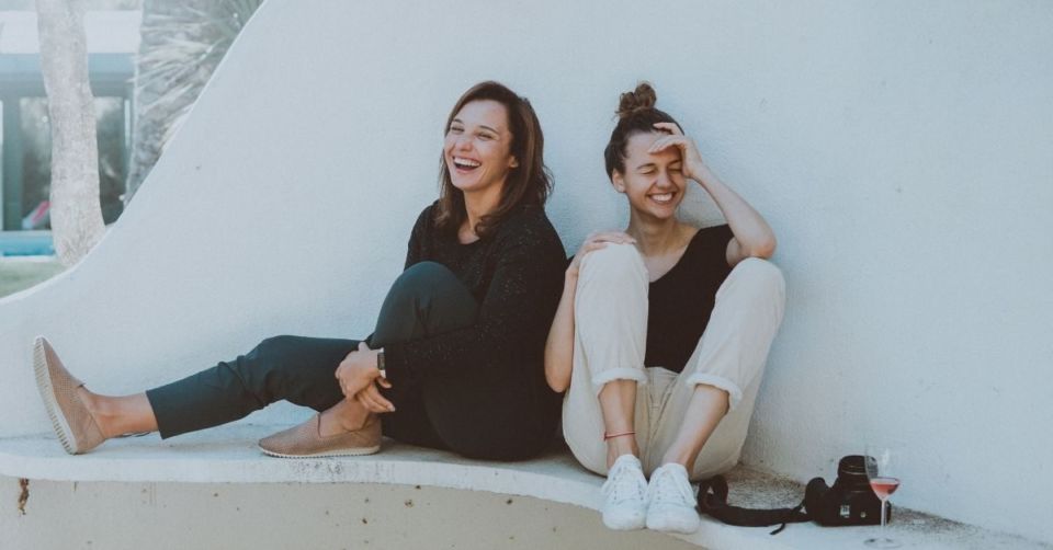 Two women being told a good story