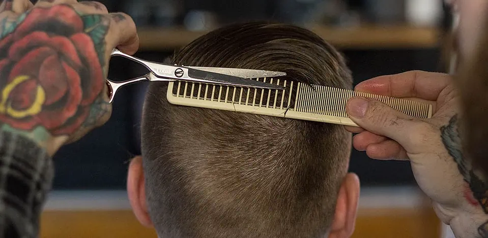 A guy hoping he doesn't get one of the common bad men's haircuts