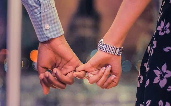 A couple holding hands on the first date